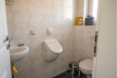 Gäste-WC - Familienfreundliches Traumhaus in Rhauderfehn – viel Platz, Garten, Terrasse & Garage