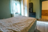 Schlafzimmer 2 - Ruhig wohnen in Ostfriesland: Ebenerdiges Einfamilienhaus mit Scheune und viel Freiraum